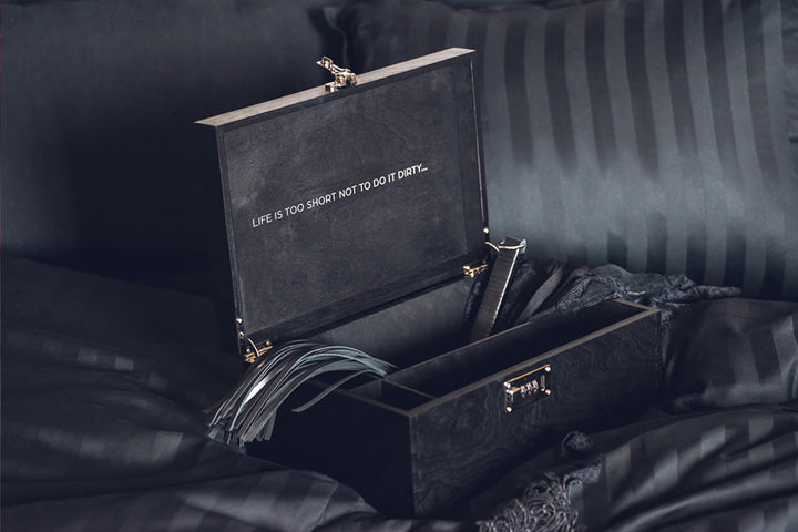 Black wooden adult toy box with lock